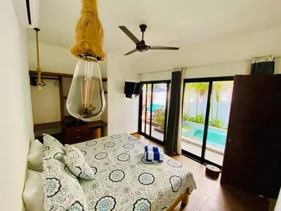 Cama o camas de una habitación en Oasis Villa a lado del mar