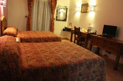 Una televisión o centro de entretenimiento en Hotel Casa Conzatti