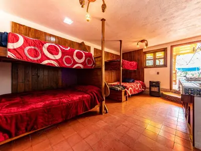 Cama o camas de una habitación en Cabañas Elsa María, Cabañas para Hospedaje con Alberca y Jardín de Eventos