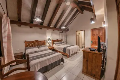 Cama o camas de una habitación en Hotel Casa Yunenisa