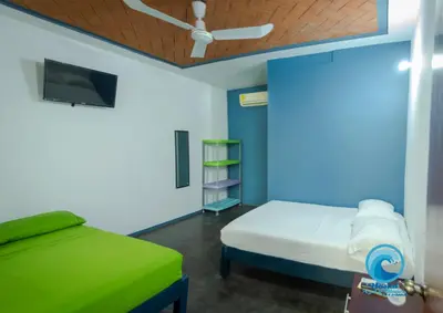 Cama o camas de una habitación en Hostal Azul y Blanco