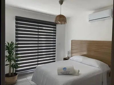 Cama o camas de una habitación en Departamento Acapulco Diamante & Beach Club
