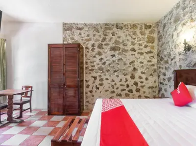 Cama o camas de una habitación en Rancho Hotel El Carmen