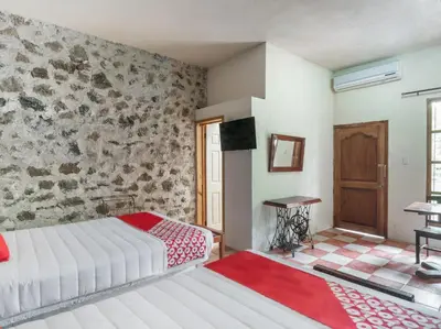 Cama o camas de una habitación en Rancho Hotel El Carmen
