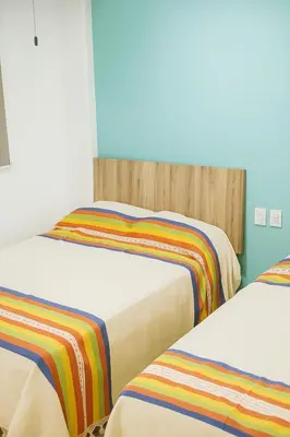 Cama o camas de una habitación en Condominio Alegre Amanecer