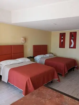 Cama o camas de una habitación en Departamento con hermosa vista al mar y acceso a playa, 2 albercas