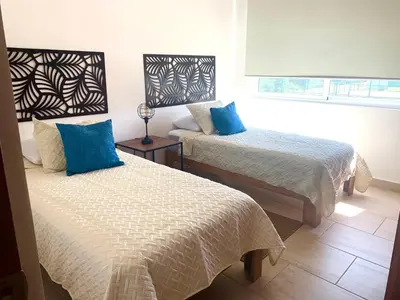 Cama o camas de una habitación en Departamento de Lujo & Club de Playa