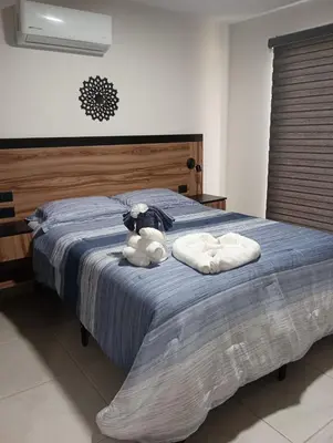 Cama o camas de una habitación en Increíble departamento Club de Playa canchas de pádel para 8 huéspedes