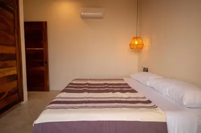 Cama o camas de una habitación en CASA RAFFAELLA Modern apartments with AC Pool Starlink