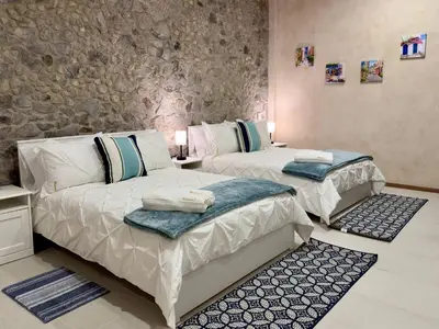 Cama o camas de una habitación en Loft Mueganos III en Val´Quirico