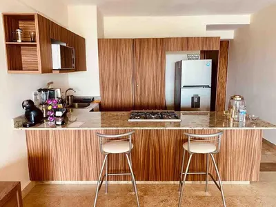 Una cocina o zona de cocina en Acogedor con 2Tvs 3 albercas, gym y ludoteca