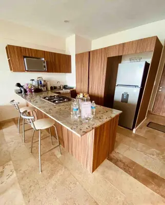 Una cocina o zona de cocina en Acogedor con 2Tvs 3 albercas, gym y ludoteca