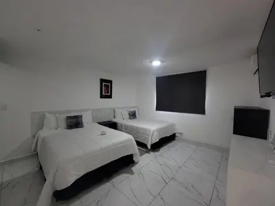 Cama o camas de una habitación en Hotel Paraiso Inn