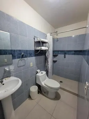 Un baño de Hotel Paraiso Inn