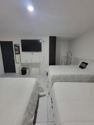 Cama o camas de una habitación en Hotel Paraiso Inn