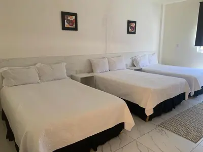 Cama o camas de una habitación en Hotel Paraiso Inn