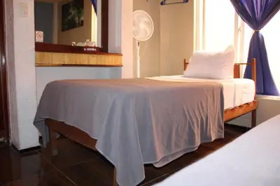Cama o camas de una habitación en Hotel Los Diamantes