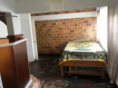 Cama o camas de una habitación en Casa antigua llena de vida, alberca en Cuernavaca