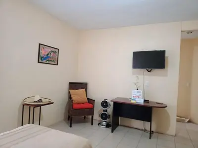 Una televisión o centro de entretenimiento en Hotel Senda del Ángel