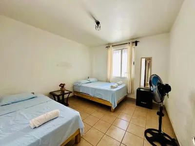 Cama o camas de una habitación en Casita Iluminada