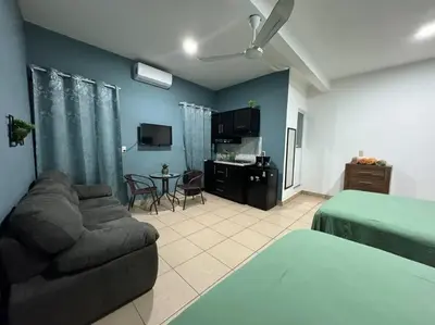 Una televisión o centro de entretenimiento en Loft Brisa Del Mar #9