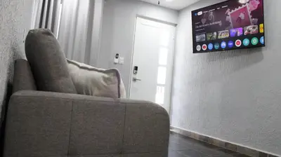 Una televisión o centro de entretenimiento en Comodo apartamento de 3 habitaciones, a 10 min en vehiculo del Zocalo de Oaxaca
