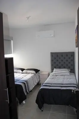 Cama o camas de una habitación en Departamento en zona diamante Acapulco