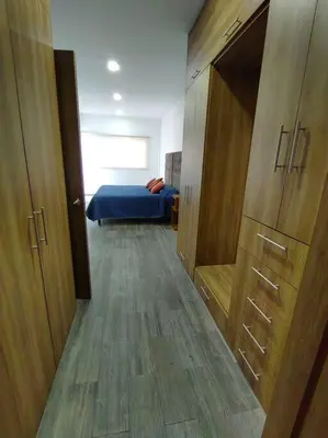 Cama o camas de una habitación en Departamento Parque Finsa, nuevo con cancha de Padel cerca de Volkswagen