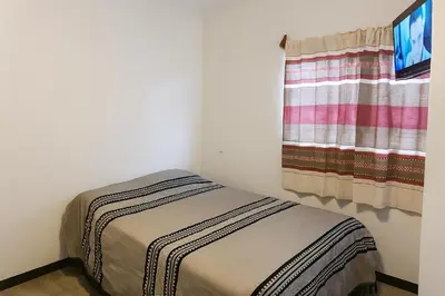 Cama o camas de una habitación en Casa Layu Oaxaca
