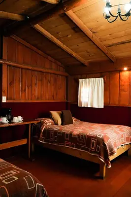 Cama o camas de una habitación en Cabañas El Encanto