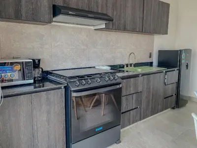 Una cocina o zona de cocina en Paraíso Costero - playa y carnaval cerca