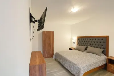 Cama o camas de una habitación en Suites C O V A D O N G A