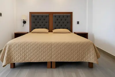 Cama o camas de una habitación en Suites C O V A D O N G A