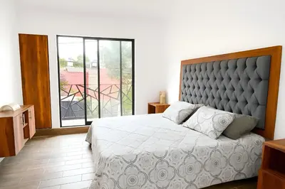 Cama o camas de una habitación en Suites C O V A D O N G A
