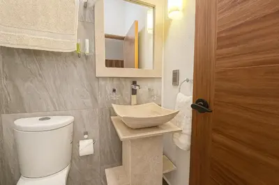 Un baño de Suites C O V A D O N G A