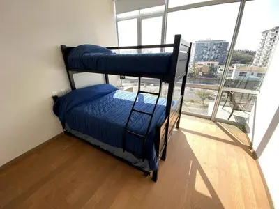 Cama o camas de una habitación en Sonata en Alpha Residences Lomas de Angelop