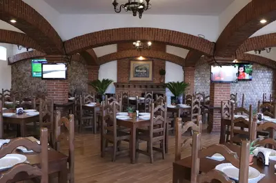 Un restaurante o sitio para comer en Hotel Cuamanco