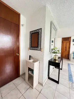 Una televisión o centro de entretenimiento en Huatulco Nice Apartment A 10 Minutos de la Playa