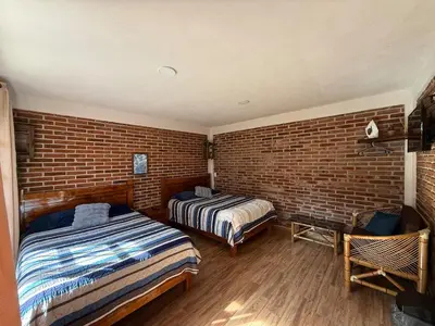 Cama o camas de una habitación en Hospedaje Vista San Carlos