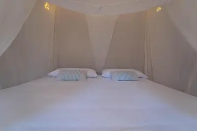 Cama o camas de una habitación en Cabanas Adobe Frente Al Mar