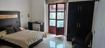 Cama o camas de una habitación en Nonó Hotel