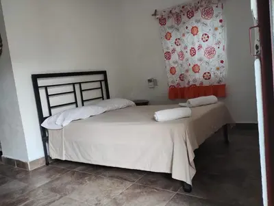 Cama o camas de una habitación en Casa Nayeeche, Hospedaje & Dive Center