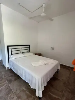 Cama o camas de una habitación en Casa Nayeeche, Hospedaje & Dive Center
