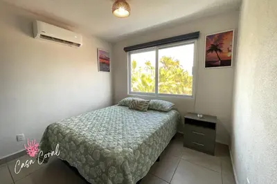 Cama o camas de una habitación en Depa Coral con Club de Playa Exclusivo Playa Bonfil Diamante