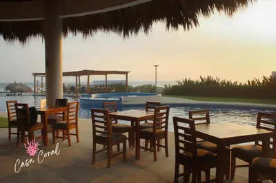 Piscina en o cerca de Depa Coral con Club de Playa Exclusivo Playa Bonfil Diamante