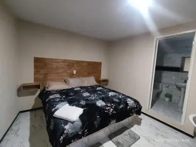 Cama o camas de una habitación en Hotel Mextlitlán Tierra de Lunas