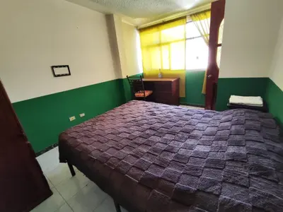 Cama o camas de una habitación en Departamentos del Jardín de Toribio