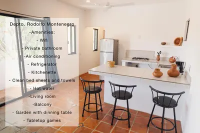 Una cocina o zona de cocina en El departamento de los Nonos