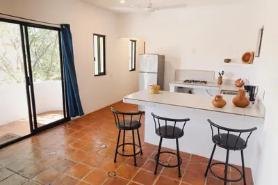 Una cocina o zona de cocina en El departamento de los Nonos