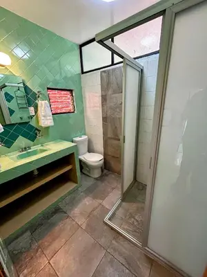 Un baño de Luz Casa de Huespedes